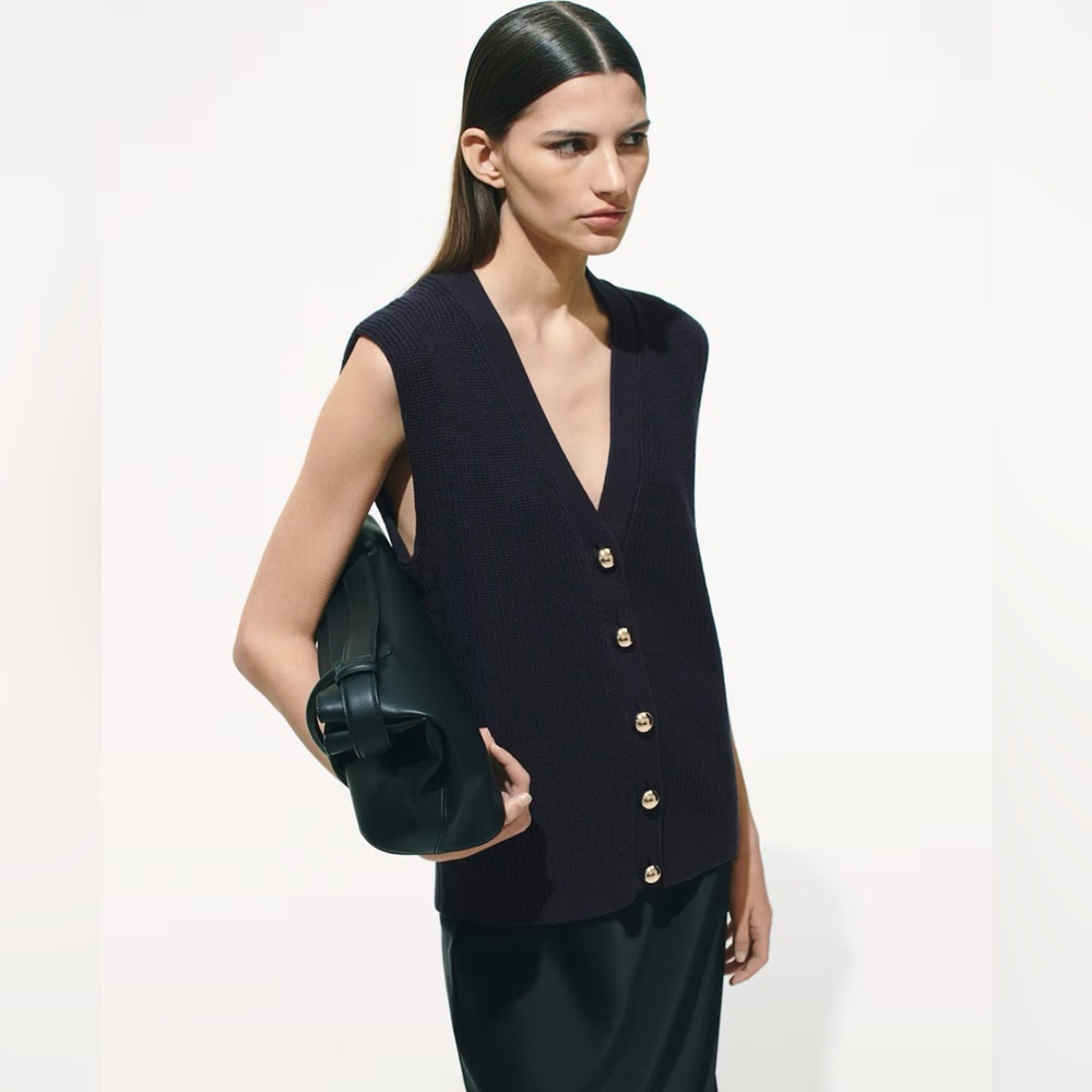 H&M navy soft ribbed knit vest with gold domed metal buttons at front.